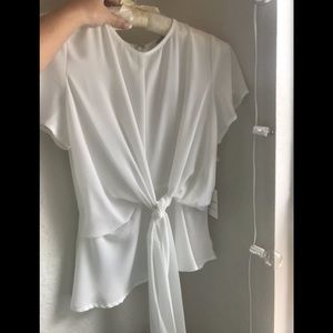 Brand new white blouse with a tie in the front